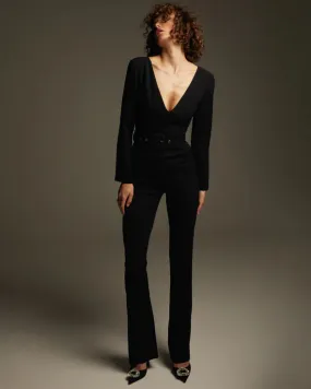 Black jumpsuit with an open back and long sleeves